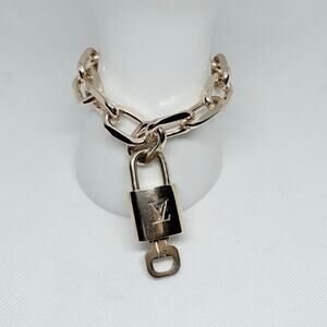 Louis Vuitton Lock and Key #312 with a Gold Chain Bracelet 8" or Bag Charm